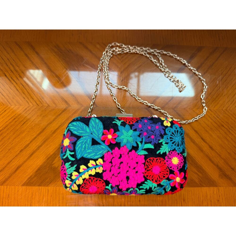 Sam Edelmen clutch embroidered flower purse on black background
